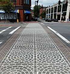 Painted crosswalk with complex multi-colored patterns in Boston