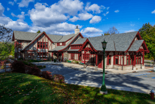 A wooden Tudor Revival-style building