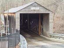 color photo of covered bridge