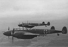 a black and white photograph of an aircraft in flight