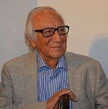 Arturo García Bustos speaking at a book presentation in the Palacio de Bellas Artes