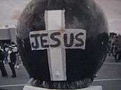 Woroniecki's CMU football helmet showing a cross with the word 'Jesus" written in it on the back of the helmet.