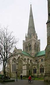 This picture of Chichester Cathedral shows the Norman windows of the Nave clerestory, the Early English windows of the tower, the Geometric windows of the aisles and the large Perpendicular window of the transept. The spire is a Victorian restoration.