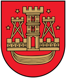 A coat of arms depicting a golden castle with three turrets surrounded with four golden stars all on a red background