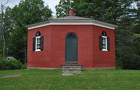 The Eight Square Schoolhouse, a red eight-sided one-room schoolhouse, in 2008