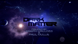 Against a space field lit by stars, the words Dark Matter in dark purple uppercase lettering.