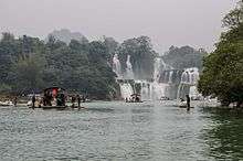 Chinese tour boats approaching falls.