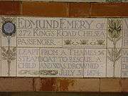 A tablet formed of five tiles of varying sizes, bordered by yellow and blue flowers in an art nouveau style