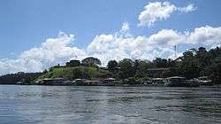 Color photograph of the village of El Castillo in southern Nicaragua as viewed from the San Juan River in February 2011