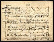 eleven-staved music manuscript sheet written in black ink, headed 'Secondo'