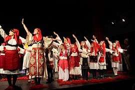 Dancers in costume onstage