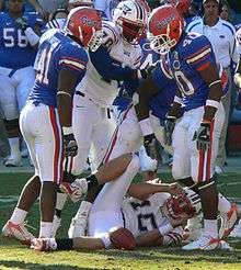 Gators (in blue and white) and Florida Atlantic Owls (in white)