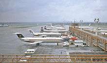 Planes lined up at a terminal