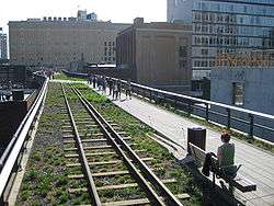 Railway tracks with the walking path cross 20th Street