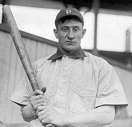 A baseball player looking directly at the camera