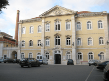 Queen Leonor Spring Water Hospital, or Thermal Hospital. Three story yellow façade.