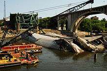 Navy recovery operation on the bank of the Mississippi with the twisted wreckage