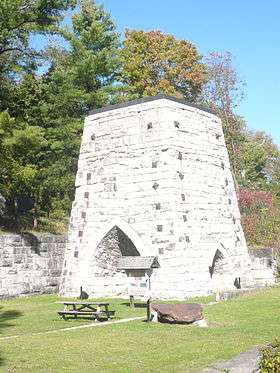 An antique stone furnace tower