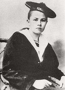 Androgynous photograph of Eberhardt as a teenager in a short haircut and a sailor's uniform