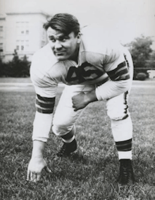 A photo of John Kissell in a three-point stance in a Cleveland Browns number 45 uniform