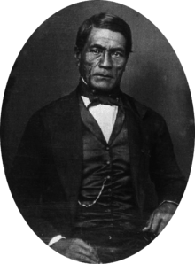 Hawaiian man in western Victorian formal suit