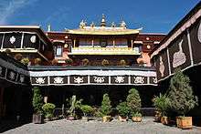 Temple courtyard with potted shrubs