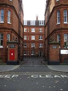 A block of flats behind a set of high security gates