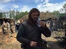 Swedish actor Joakim Nätterqvist taking a break on the set of Viking.