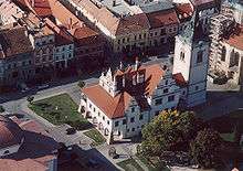 A building with towers in a town