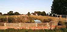 small brick parapet bridge over the stream