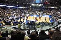 An indoor arena filled with people.