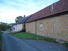 A series of houses along a lane.