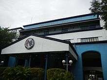 The facade of the station which is holding the old logo and the acronym at the top.