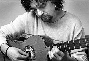 Young man playing a guitar