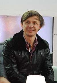 Martin Solveig in a black jacket smiling