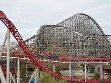 An overview of the Mean Streak roller coaster in the background with the Maverick roller coaster in the foreground