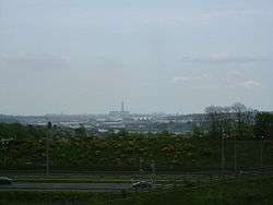 In sight are the M2, Rochester Bridge and Castle, the covered slips at Chatham Dockyard, Kingsnorth Power station and in the far distance the Grain Power Stations