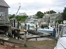 Fishing cottages and boats on Menemsha's harbor.