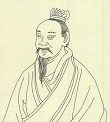 A black drawing of Mozi's face on a yellow background