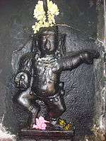 image of Navneeta Krishna on a granite pillar of the temple