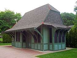 A small train station with Tudor Revival architecture