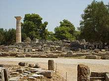 Ruins of buildings and a column.