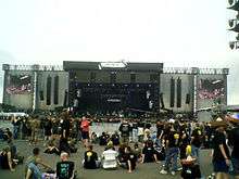 Open-air festival stage in daylight