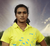 A photograph of a woman wearing yellow coloured t-shirt.