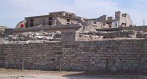 Large stone building, protected by a low chain fence