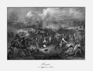 Black and white print shows Russian cavalrymen in tall helmets. In the center General Saint-Cyr's carriage is overturned while in the background there is a melee between horsemen and foot soldiers.