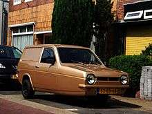 A modified late model reliant robin in bright red colour