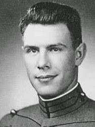 Black and white photograph portrait of a young man in uniform.