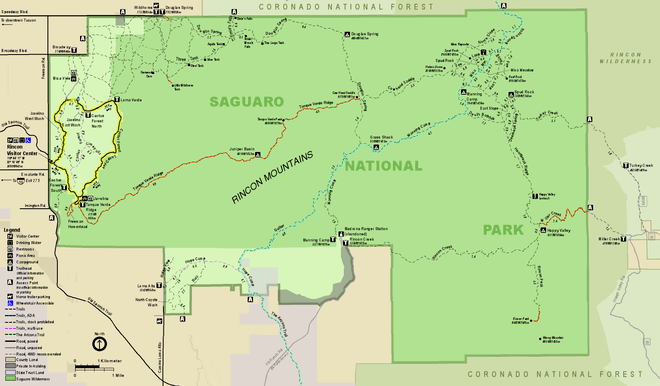 Map of the RMD, an irregular retangle, wider than long, colored green, and surrounded by areas colored brown or light purple that are outside the park