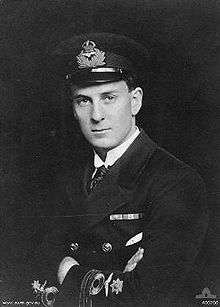 Half portrait of man in dark-coloured military uniform with peaked cap